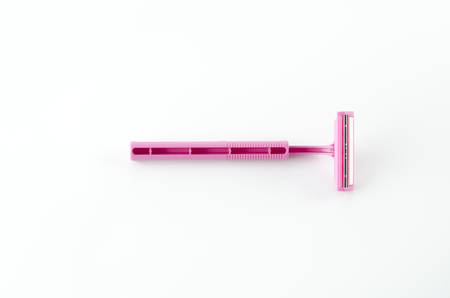 pink disposable shaving on a white backgroundの写真素材