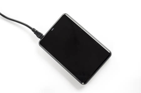black external harddisk on a white の写真素材