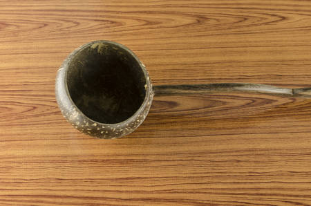 thai wood bowl container for drinking water on wood backgroundの写真素材