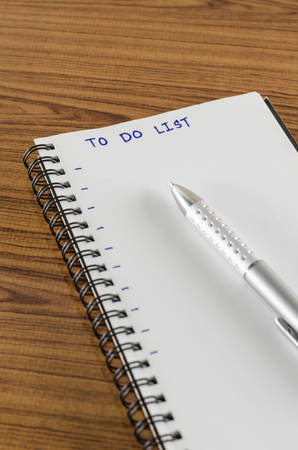 notebook and pen with word to do list on wood backgroundの写真素材