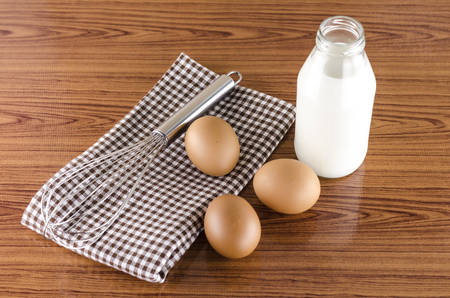 whisk egg and milk concept tools for baking beakery