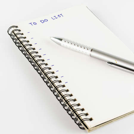 notebook with pen write to do list word on a white back ground