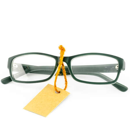 glasses and cost tag on a white backgroundの写真素材
