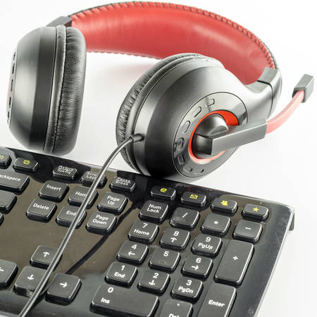 keyboard computer and headphone on a white backgroundの写真素材