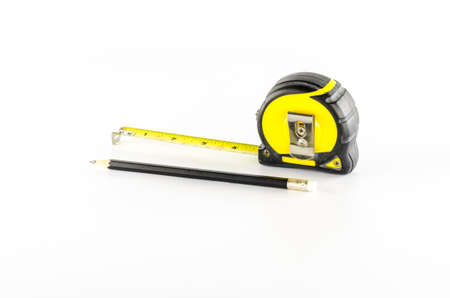 measuring tape with pencil on a white backgroundの写真素材