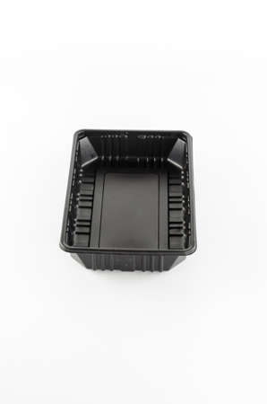 black plastic tray on a white backgroundの写真素材