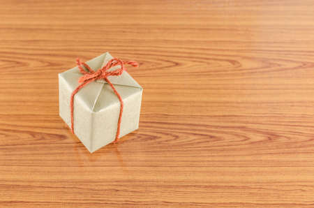 brown gift box on wooden backgroundの写真素材