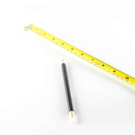 measuring tape with pencil on a white background