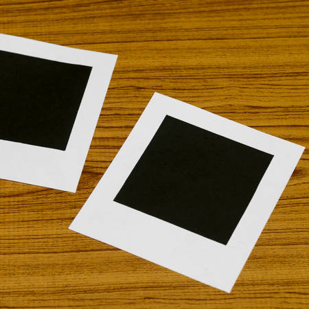 photo frame on wood backgroundの写真素材