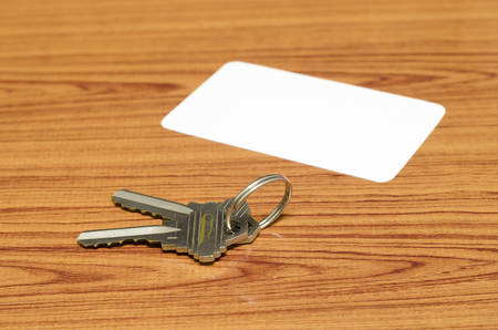 business card and keys on wood backgroundの写真素材