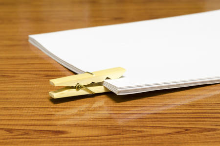 wooden pin paper on wood background