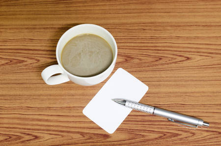 coffee cup and business card on wood backgroundの写真素材