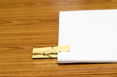 wooden pin paper on wood backgroundの写真素材