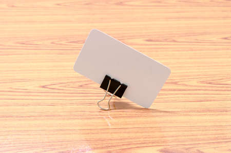 card and clip design on wood backgroundの写真素材