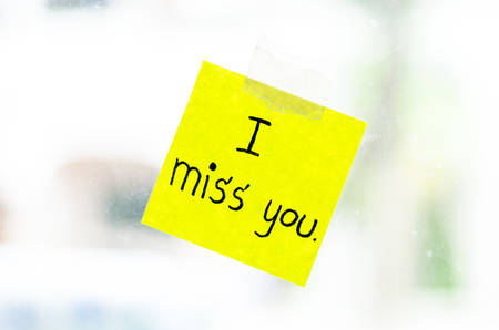 I miss you word sticky note on window mirrorの写真素材