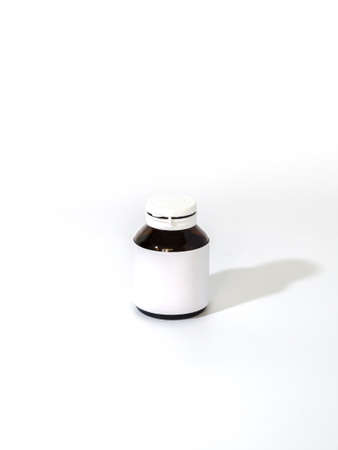 empty pill bottle on a white backgroundの写真素材