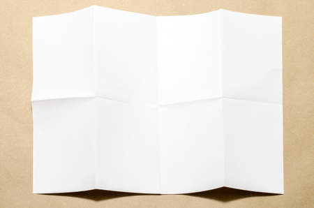 Empty white Crumpled paper on brown color backgroundの写真素材