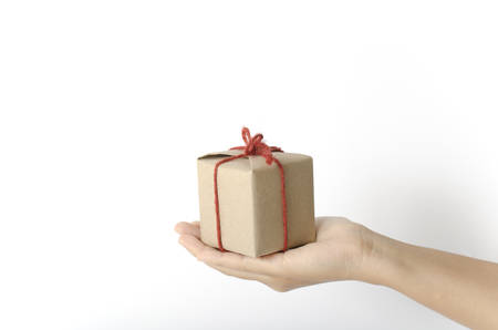 asia woman hand holding gift box on a white backgroundの写真素材