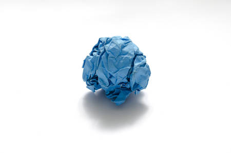 blue color crumpled paper ball on a white background