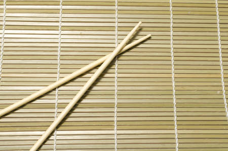 chopsticks on matの写真素材