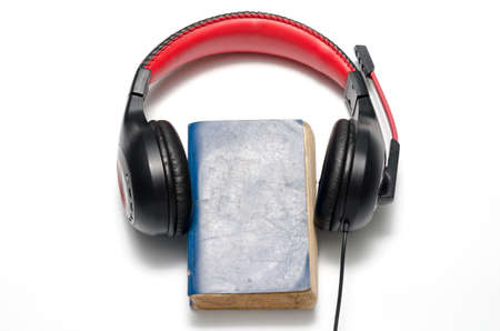 head phone with book concept audio book on a white backgroundの写真素材