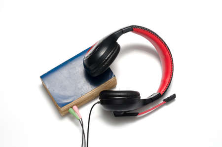 head phone with book concept audio book on a white backgroundの写真素材