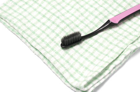 tooth brush and towel on a white background