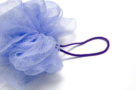 purple bath puff isolated on a white backgroundの写真素材