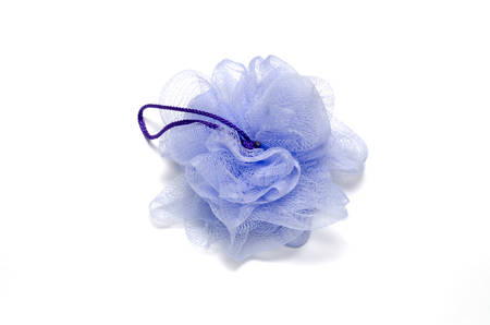 purple bath puff isolated on a white backgroundの写真素材