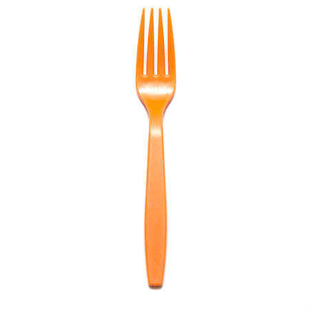 orange plastic fork on a white の写真素材