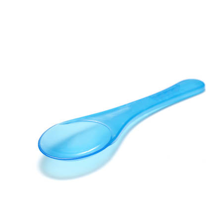 blue plastic spoon on a white の写真素材