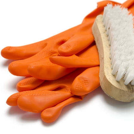 wash brush and orange gloves on a white backgroundの写真素材