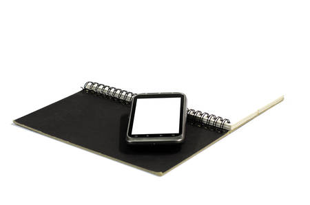 smartphone on note book on a white backgroundの写真素材