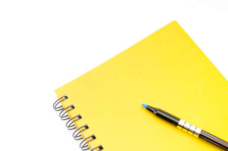 orange notebook isolated on white backgroundの写真素材