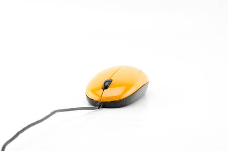 orange computer mouse isolated on white backgroundの写真素材