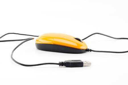 orange computer mouse isolated on white backgroundの写真素材