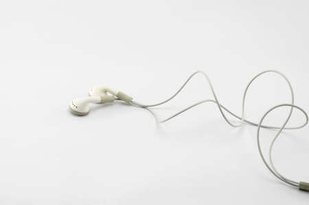white earphone isolated on white backgroundの写真素材