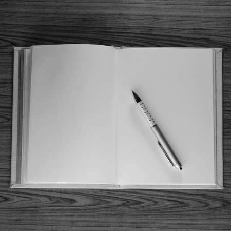 top view notebook and pen black and white tone color