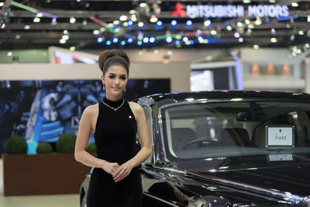 BANGKOK,THAILAND - APRIL 4 :New Classical car brand Rolls-Royce show on April 4,2015 at the 36th Bangkok international motor show in Thailand.Beautiful woman with classical car brand call Rolls-Royce.のeditorial素材