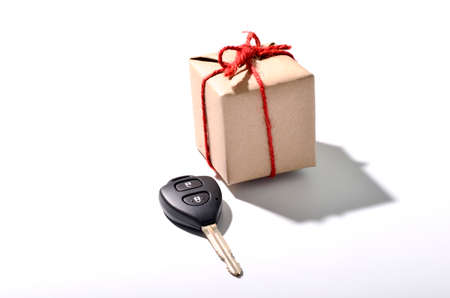 car key and gift box isolated on white backgroundの写真素材