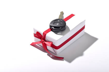 car key and gift box isolated on white backgroundの写真素材