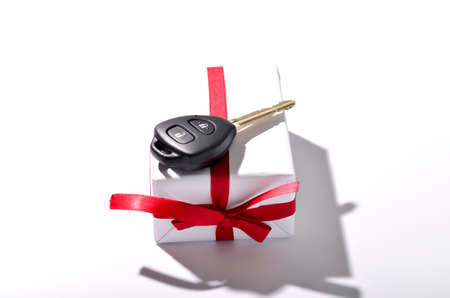 car key and gift box isolated on white backgroundの写真素材