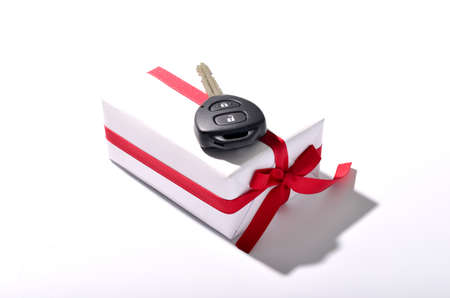 car key and gift box isolated on white backgroundの写真素材
