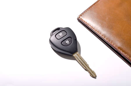 car key with wallet isolated on white backgroundの写真素材