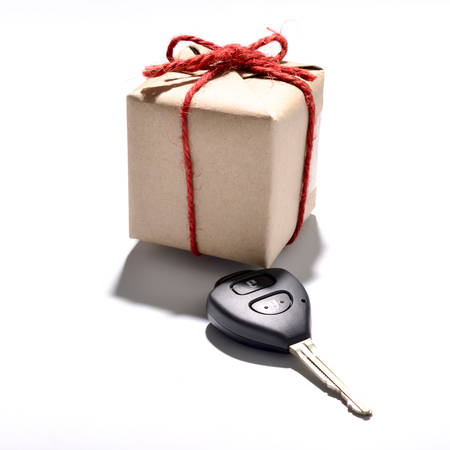 car key and gift box isolated on white backgroundの写真素材