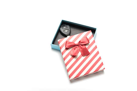 car key and gift box isolated on white backgroundの写真素材