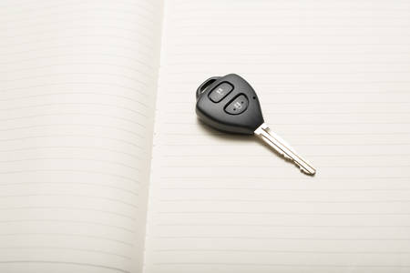 car key on notebook paperの写真素材