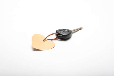 car key and heart tag isolated on white backgroundの写真素材