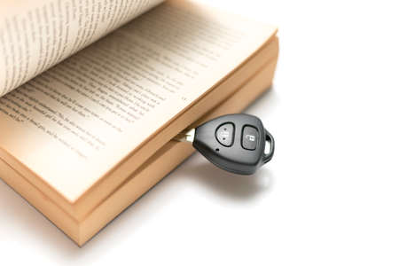 car key with book isolated on white backgroundの写真素材