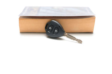 car key with book isolated on white backgroundの写真素材